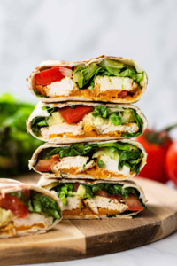 High protein chicken wrap cut in half showing avocado and chicken